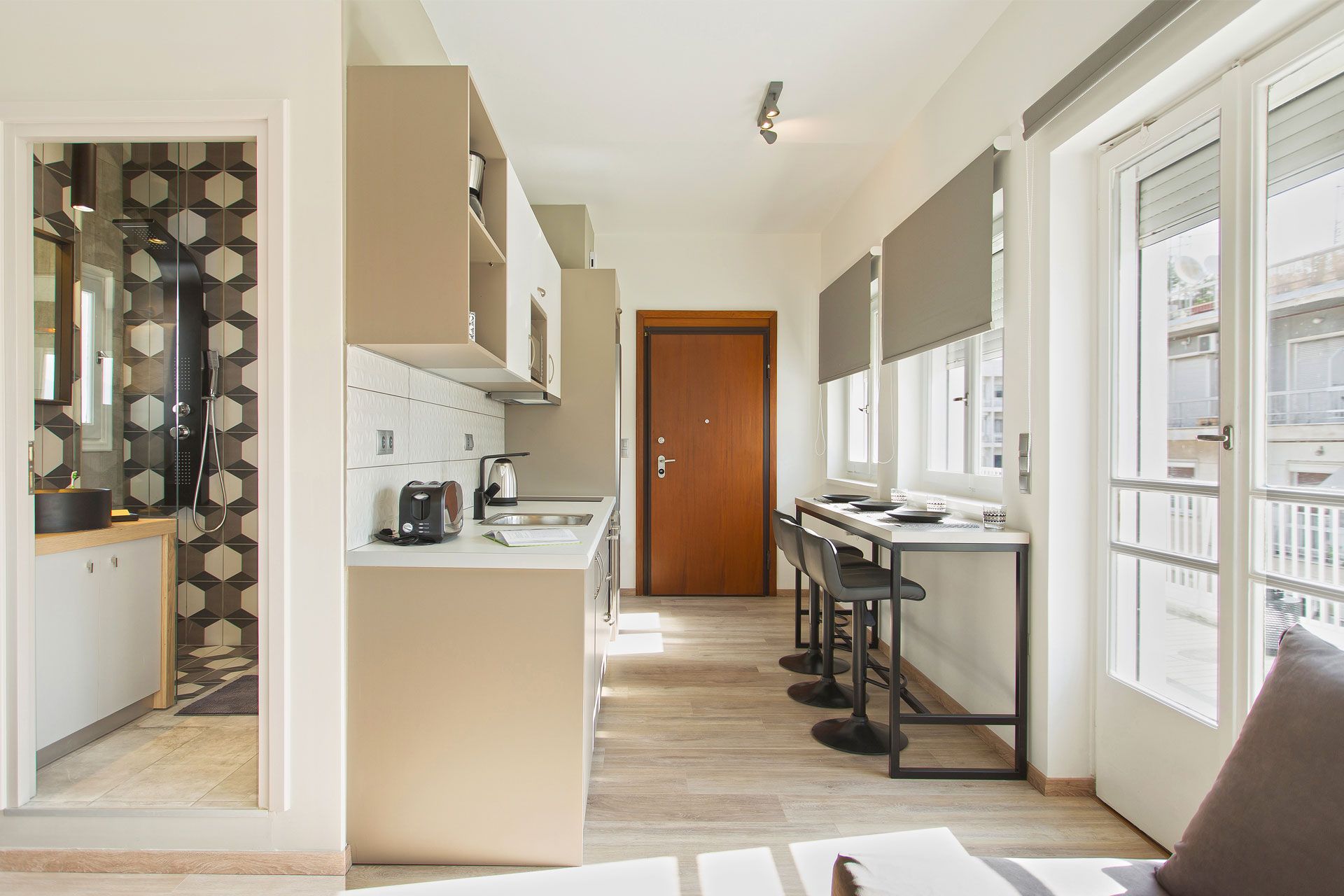 studio apartment penthouse entrance with open plan kitchen